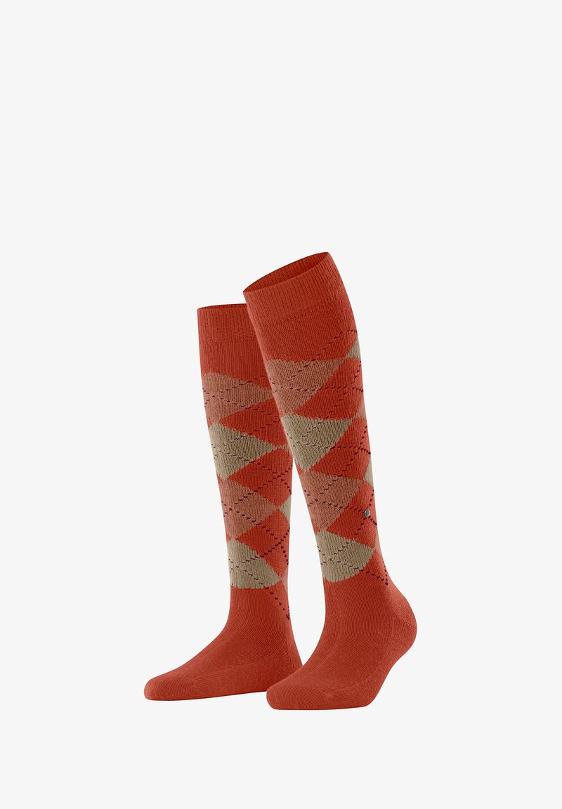 Skarpetki do kolan w kolorze pomarańczowym z dużym wzorem diamentów w beżu i jasnym brązie. Żebrowana tekstura u góry, z delikatnymi detalami.