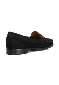 Black suede loafer with a rounded toe, low heel, and decorative gold hardware on the front. Seam stitching detail along the edges.