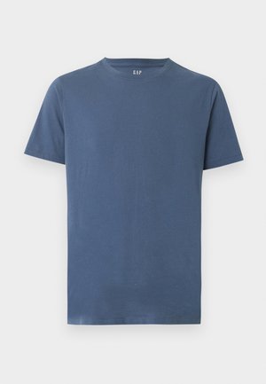 Schlichtes blaues Kurzarm-T-Shirt mit Rundhalsausschnitt und GAP-Logo im Nacken, auf weißem Hintergrund dargestellt.