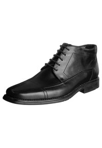 Stivali ankle in pelle nera con punta arrotondata, design con lacci e dettagli cuciti sulla tomaia e sui lati. Texture liscia e tacco basso.