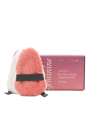 Coral and white plush reusable washpad with a black strap, packaged in a pink box labeled "for a better cleansing." Sustainable material.