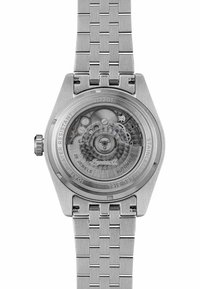 Zegarek automatyczny ze stali nierdzewnej z sześciokątną kopertą, srebrną bransoletą typu mesh, przezroczystym tyłem odsłaniającym skomplikowane mechanizmy, oznaczony jako wodoodporny.