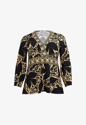 Langærmet V-hals bluse med sorte fugle- og blomsterprint på beige baggrund, med dekorativt bånd på tværs af brystet og taljen.