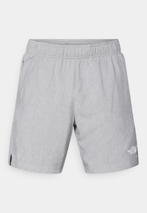 Lysgrå shorts lavet af struktureret stof, med elastisk talje, sidelommer og et logo på nederste højre ben.