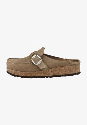 Brown suede slip-on clog with cork sole and silver buckle strap across the top against a white background.