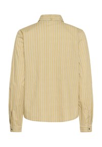 Chemise beige à boutons avec des rayures verticales blanches, à manches longues et col rabattu, vue de dos.