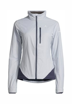 Světle šedá lehká bunda s vysokým límcem, předním zipem a námořnickými akcenty. Má kapsu na levé části hrudi a elastické manžety.