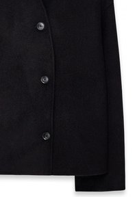 Black wool-blend coat with a notched lapel, featuring five black buttons along the front and a soft, textured surface.