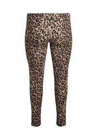 Leopard print leggings featuring a soft texture, elastic waistband, and a fitted shape. The fabric displays dark spots on a light brown base.