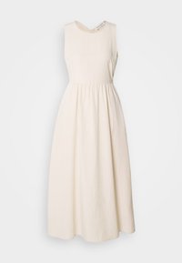 Sleeveless, cream-colored dress made of lightweight fabric, featuring a V-neckline, cinched waist, and a flowing, ankle-length skirt.