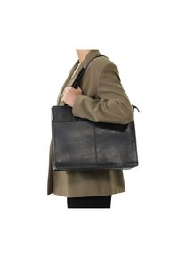 Sac en cuir noir avec une conception structurée, doté d'une poche avant et de courtes poignées, présenté sur un fond neutre.