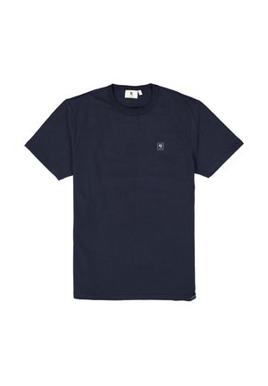 Navy blue t-shirt made of textured fabric, featuring a round neckline and a small logo patch on the chest. Short, straight sleeves.