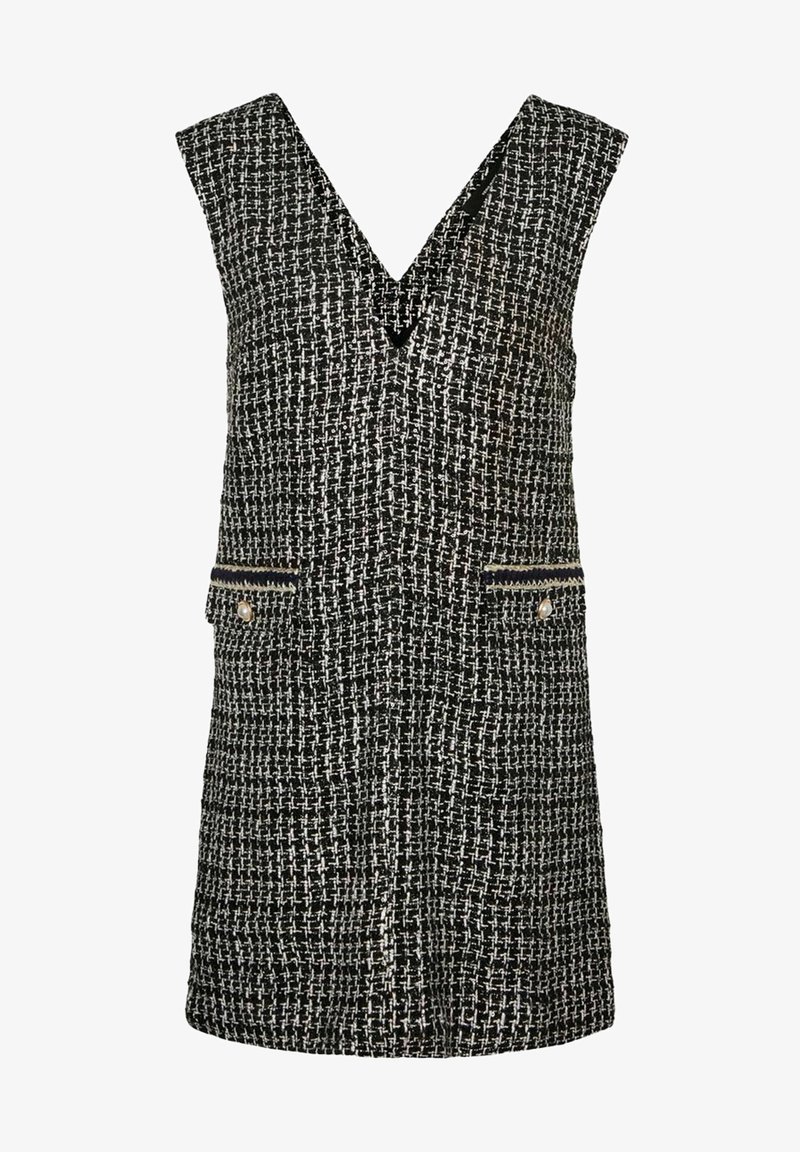 Robe sans manches en tweed noir et blanc avec un col en V, dotée de deux poches avant ornées d'accents dorés et d'un motif tissé texturé.
