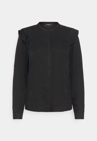 Blouse noire à manches longues avec un col rond, des volants subtils aux épaules et une fermeture à boutons sur le devant. Tissu lisse, léger, légèrement ajusté.
