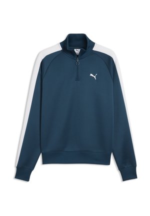 Pull bleu marine avec des rayures blanches aux épaules, fermeture éclair au quart, col, poignets et bas côtelés, et petit logo Puma blanc sur la poitrine gauche.