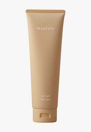 Tube souple beige étiqueté lubrifiant Waphyto, 100 grammes 3,5 onces, avec bouchon à clapet sur fond blanc.