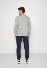 Champion BASIC CUFF PANTS - Tréningruha alsók - dark blue