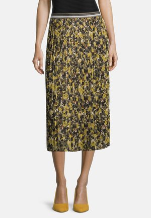 Faltender Midirock in einem mehrfarbigen, camouflageähnlichen Muster mit gelben, grünen und schwarzen Farbtönen. Elastischer Bund mit metallic Akzenten.