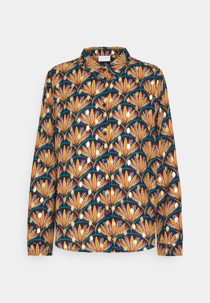 Chemise à manches longues en tissu lisse présentant un fond marine avec un motif floral coloré dans des tons d'orange, de jaune et de vert.