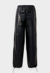HUTENI - Pantaloni - black