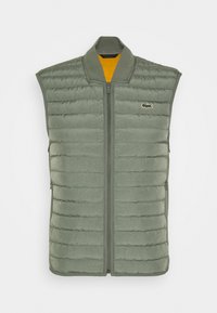 Lightweight sleeveless vest in olive green. Padded design with horizontal stitching, front zipper, and a contrasting orange inner lining. Lacoste logo.