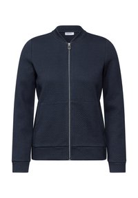 Giacca zip-up blu navy con un motivo a spina di pesce testurizzato, design aderente, polsini e orlo a costine, e colletto alto.