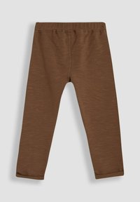 Brown, fitted leggings made of soft, textured fabric. Features an elastic waistband and tapered legs with a slight cuff at the ankle.