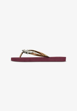Mauve rubber teenslippers met een gestructureerde paarse voetbed en metallic bronzen banden met decoratieve rhinestone accenten.