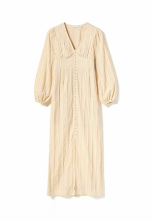 Beige, tekstureret midi-kjole med dyb V-udskæring, puffede ærmer og knaplukning midt foran. Har lodrette striber og slids ved kanten.