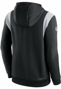 Sweat-shirt à capuche noir avec panneaux d'épaule gris côtelés, patch logo NFL sur la manche droite et texte "Therma Fit" près de l'ourlet inférieur.