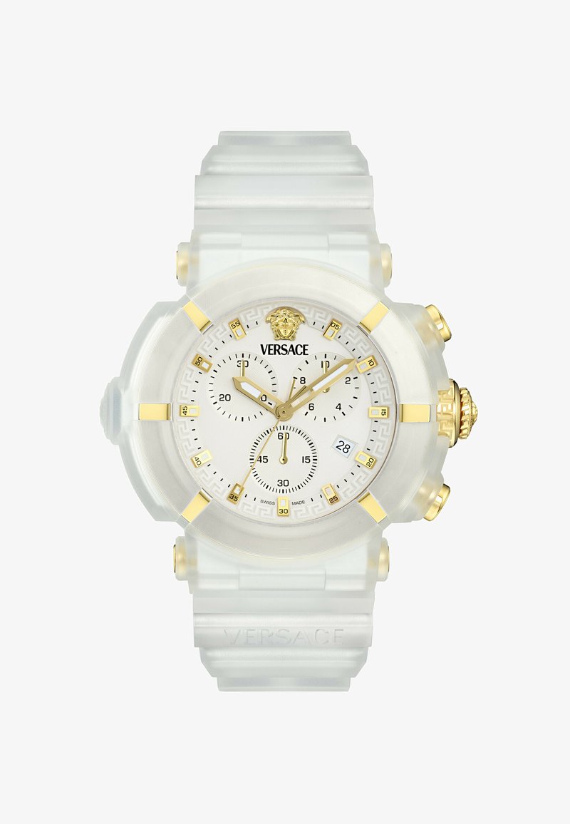 Selge plastist kell valge näo ja kuldsete aktsentidega. Omab tekstuuriga ääret, kolme alampaneeli ja lõvimuudatlogo.