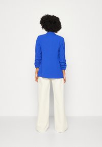 Marks & Spencer Kort kappa / rock - blue