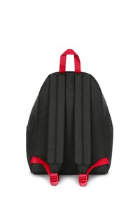 Black backpack with padded back, red adjustable straps, and a sturdy carrying handle. Textured fabric and simple, functional design.