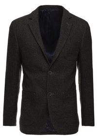 Tmavě šedý oblekový blazer v herringbone vzoru, vyrobený z texturované látky. Obsahuje dva přední knoflíky, dvě nápadné kapsy a hladké námořnické podšívku.