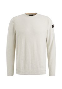 Sweat-shirt à manches longues beige clair, col ras du cou, tissu texturé, détail côtelé à l'épaule et étiquette noire près de l'épaule gauche.