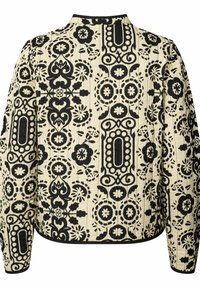 Giacca trapuntata con un motivo floreale e geometrico nero su uno sfondo beige. Bordo nero lungo il colletto e l'orlo.