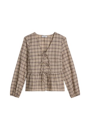 Blouse à manches longues à carreaux beige et marron avec encolure en V et trois fermetures à nouer sur le devant, poignets élastiques, et taille légèrement froncée.