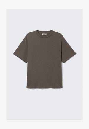 Donkergroene katoenen T-shirt met ronde hals, korte mouwen en een relaxte pasvorm, met een label dat "WEEKDAY" zegt.