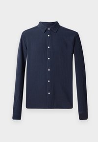 Marineblauwe blouse met lange mouwen en een button-down kraag, gemaakt van een textuurstof en met witte knopen aan de voorkant. Rechte onderkant.
