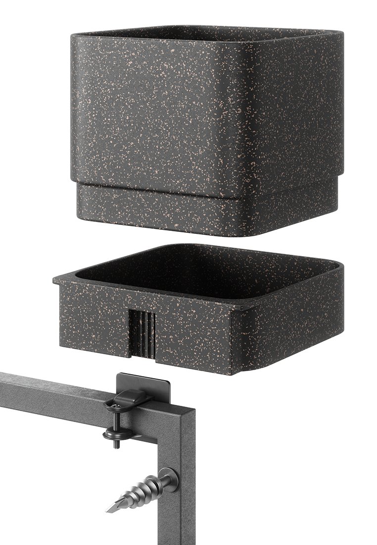 Två prickiga svarta kvadratiska behållare, en ovanför den andra, med en svart metallram och en justerbar klämma med en skruv under dem.