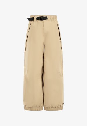 Pantalons beiges, arrivant aux genoux, en tissu léger avec une taille élastique et une ceinture ajustable. Équipés de poches latérales et de poignets élastiques.