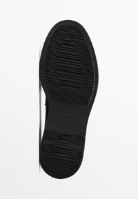 Black rubber shoe sole with textured tread pattern. Features logo imprint, side details, and a rounded heel for grip and stability.