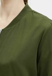 Object Tröja med dragkedja - mottled green