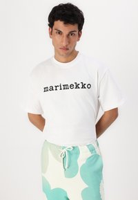 Marimekko FINAALI UNIKKO UNISEX - Pantaloni sportivi - off white/green