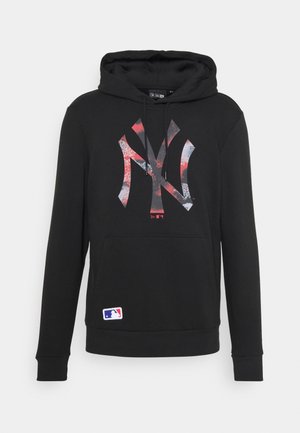 Sweat à capuche noir avec logo New York Yankees rouge et blanc usé et emblème MLB près de l'ourlet.