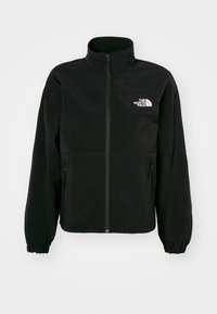 Crna jakna na zip s visokim ovratnikom, elastičnim manžetama, dva bočna džepa i bijelim logom na lijevoj strani grudi. Mekana, glatka tekstura tkanine.