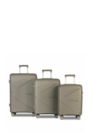 Three hard-shell suitcases in taupe, featuring a diagonal ribbed design, with telescopic handles and four spinner wheels for mobility.