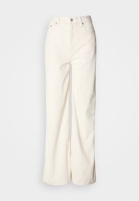 Pantalon en velours côtelé crème taille haute, jambes larges, fermeture devant par bouton et zip, passants pour ceinture, design cinq poches.