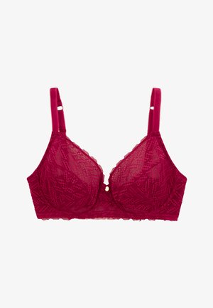 Soutien-gorge en dentelle de couleur magenta profond, avec des bonnets doux, des bretelles réglables et un petit accent décoratif doré au centre. Motif texturé sur l'ensemble.
