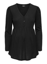 Haut de maternité noir à manches longues avec col en V, trois boutons sur le devant, taille empire froncée et tissu subtilement texturé.